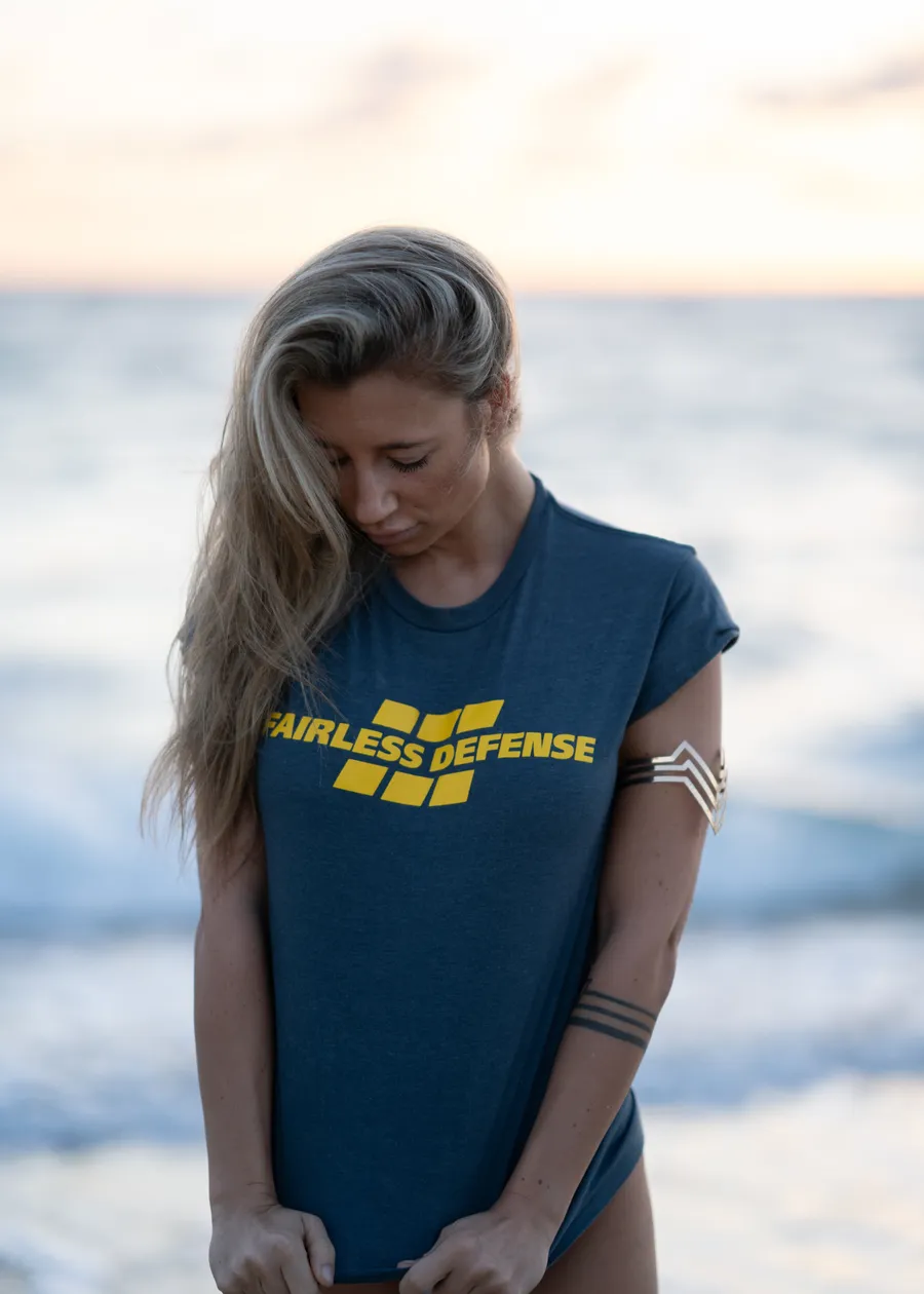 Fairless Defense navy tee at the beach