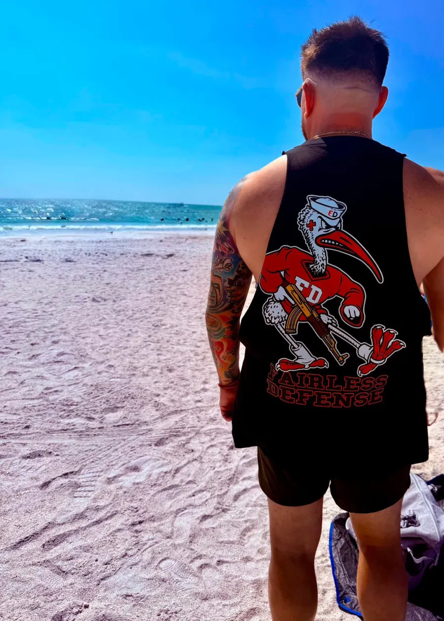 Fairless Defense graphic tank at the beach