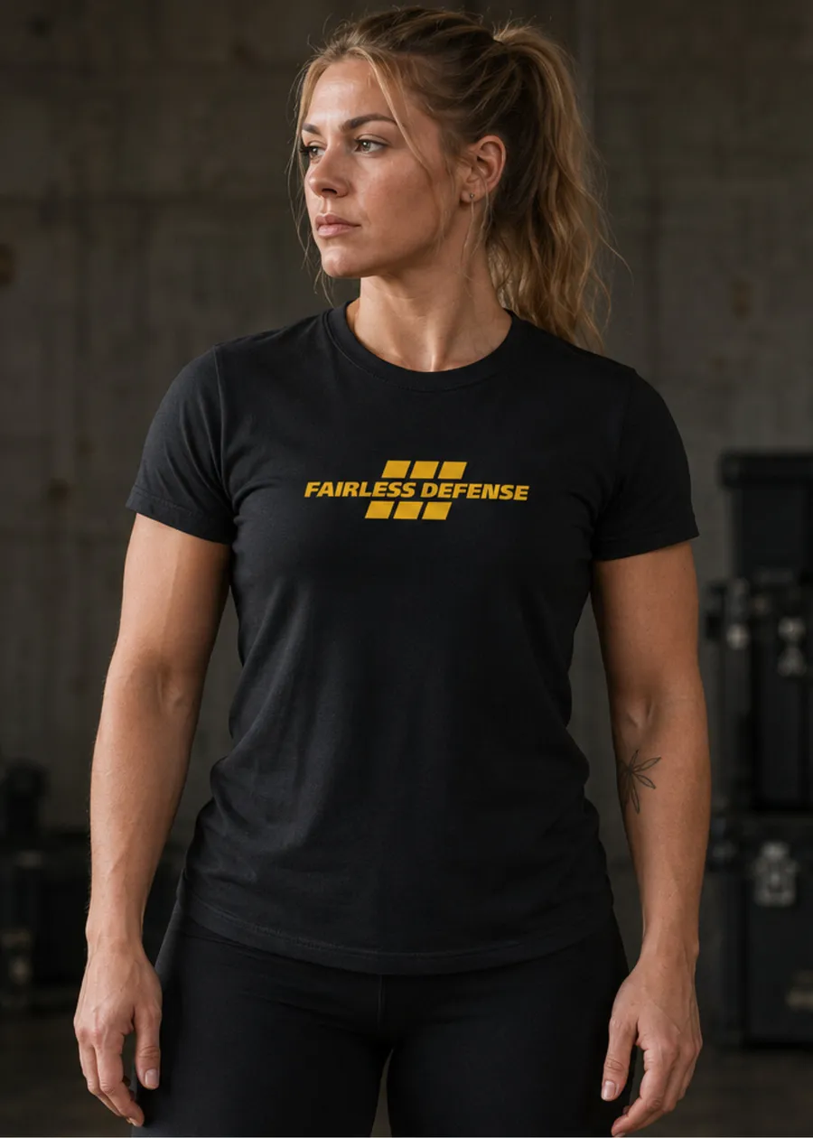 Fairless Defense black tee in the gym