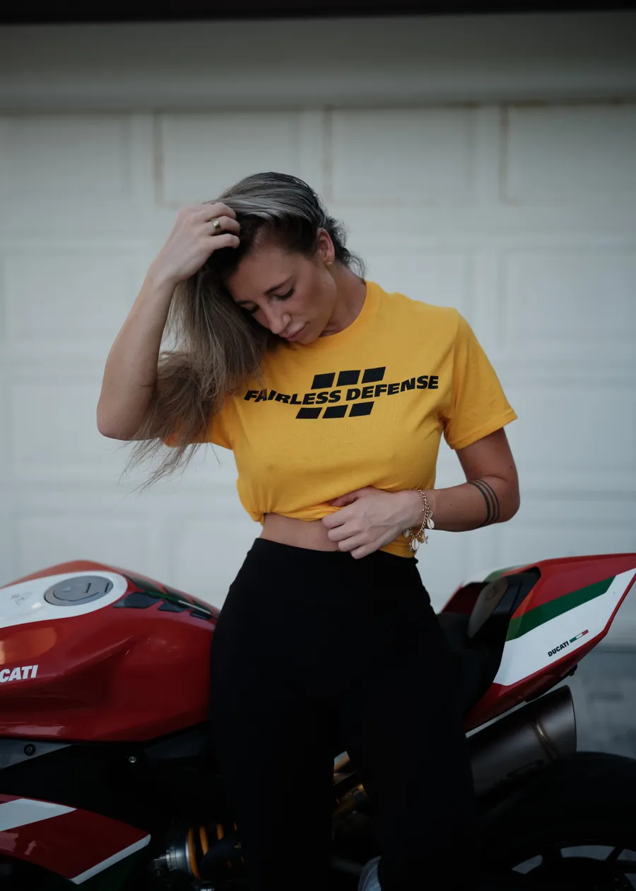 Fairless Defense yellow tee with motorcycle